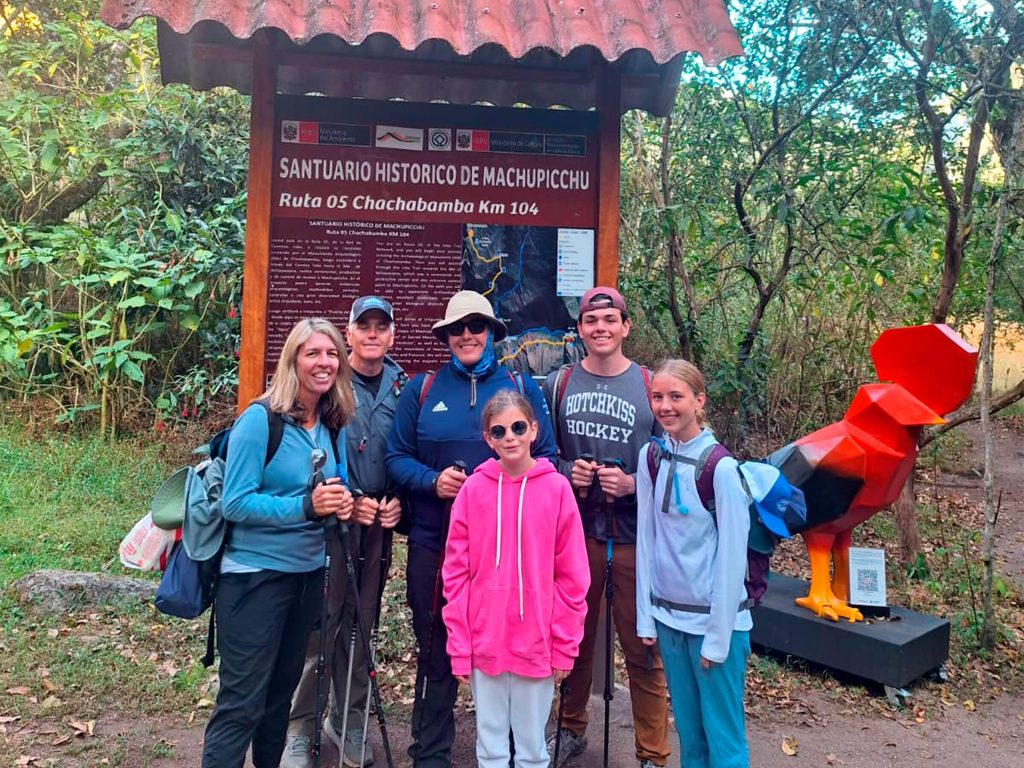 Family group of different ages at the Chachabamba checkpoint, Km 104, start of the Short Inca Trail