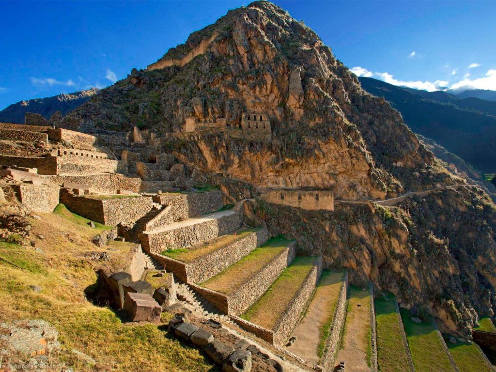 Planning the Inca Trail from the USA (2027): Passport, Flights, Time Zones and a 9-Day Plan 1 Inca terraces of Ollantaytambo climbing the mountainside in the Sacred Valley under a blue sky