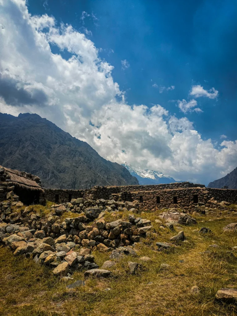 Inca Trail in September 2027: The Best Balance of Weather and Crowds 1 Inca stone ruins in a grassy clearing with mountains behind on the Inca Trail