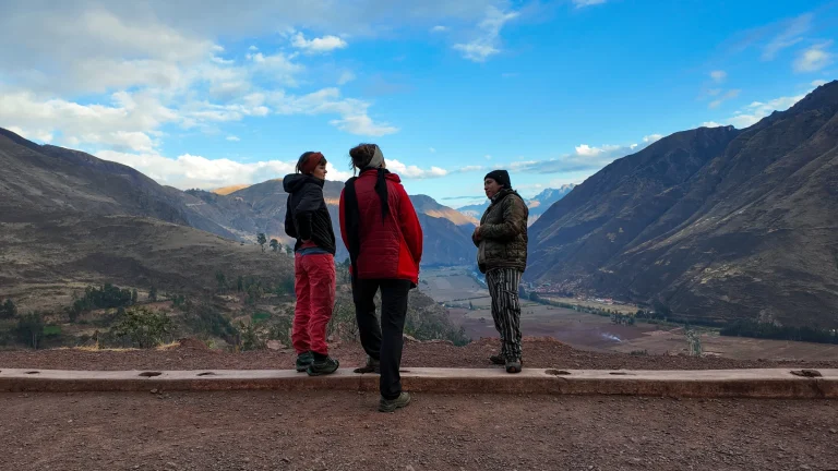 Hikers at a viewpoint over an Andean valley at the start of the Lares trek