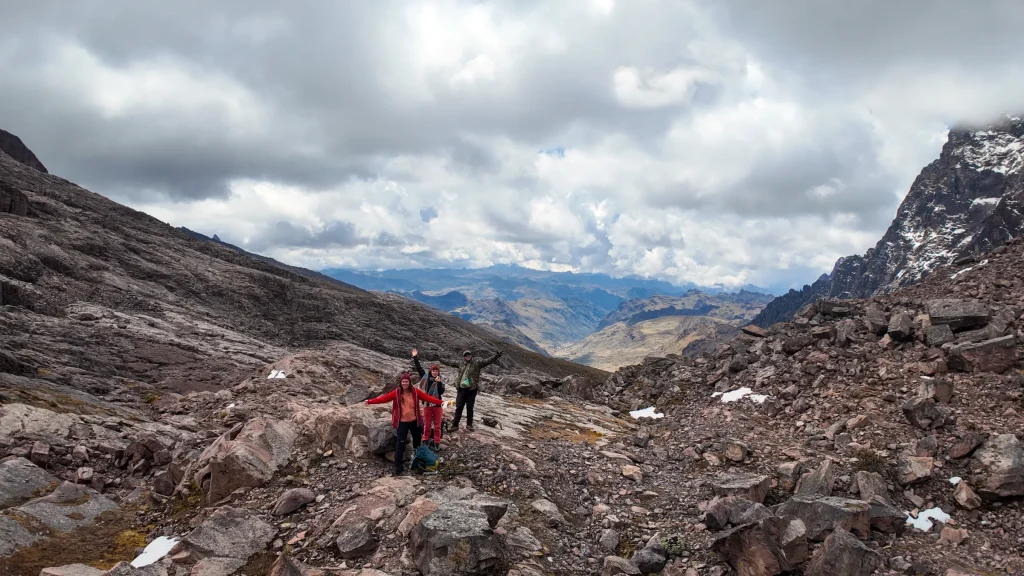 Hikers climbing a rocky high pass on the Lares trek