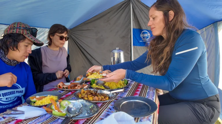 Hikers sharing lunch in the Terra Quechua dining tent on the Lares trek