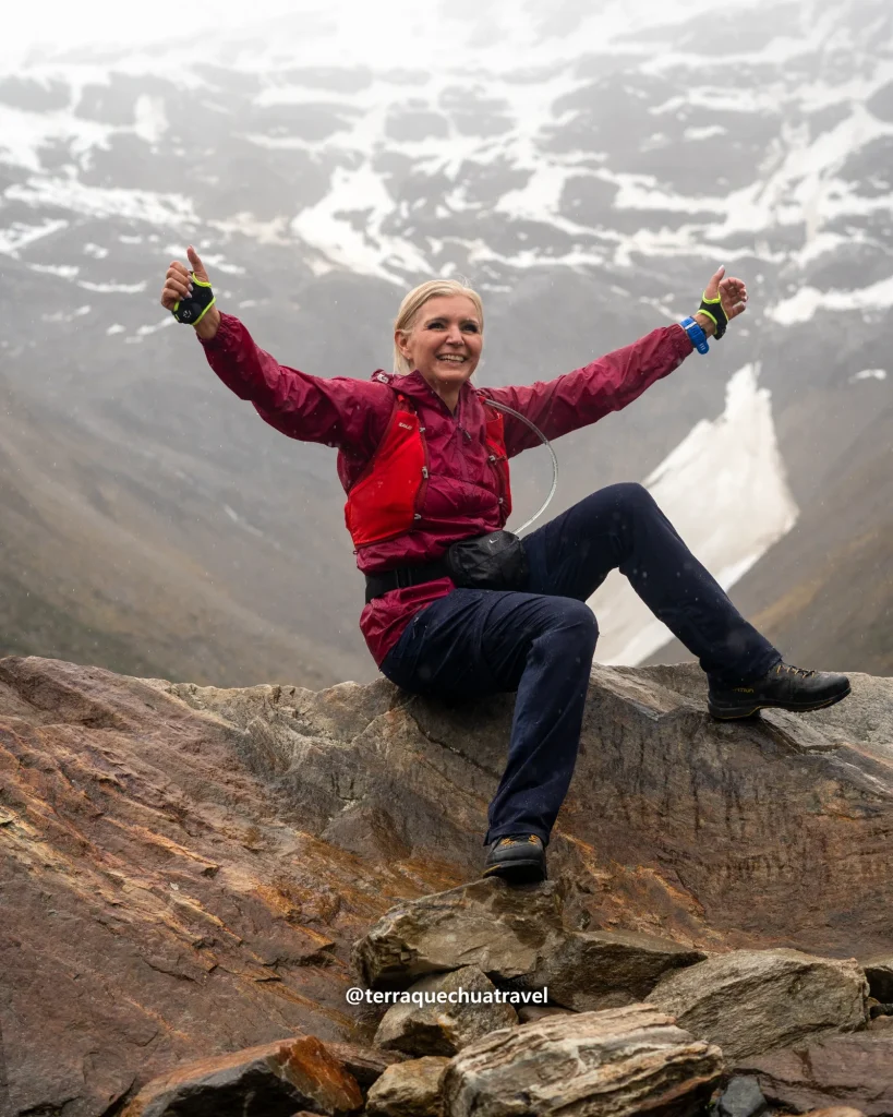 Inca Trail vs Salkantay Trek: Which Is Better for You? 1 Hiker celebrating on a rock in front of a glacier above Humantay Lake on the Salkantay trek